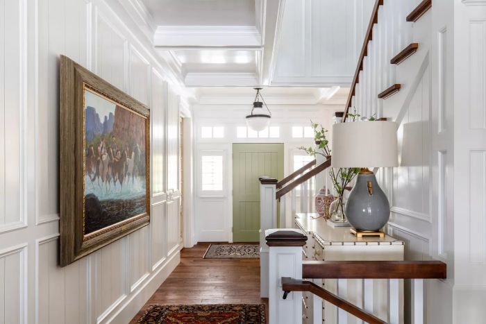 An entryway painted in Swiss Coffee creates a welcoming, neutral foundation that complements a variety of design styles.