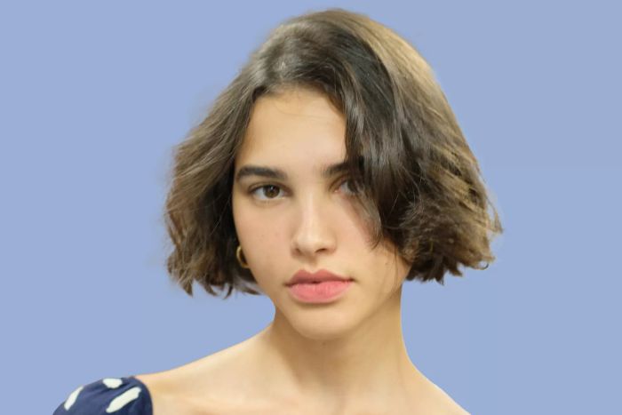 a woman sporting a chic bob haircut
