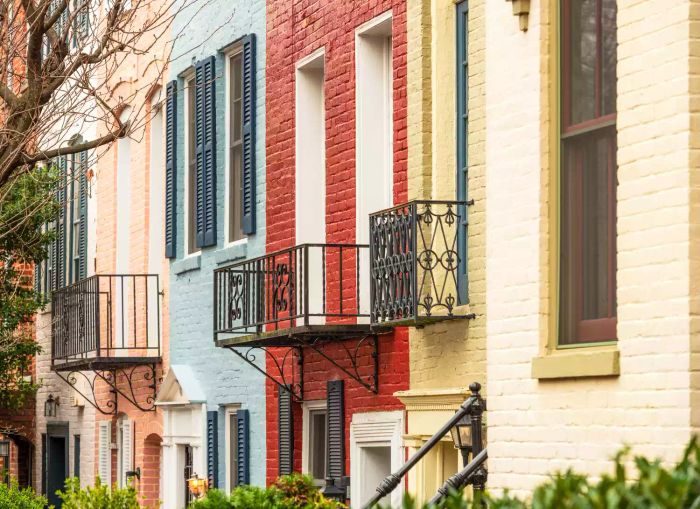 A row of vibrantly painted brick houses