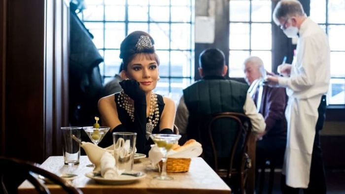 Audrey Hepburn's iconic Holly Golightly appeared strikingly lifelike at Peter Luger Steak House.
