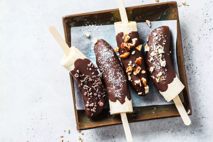 Bananas dipped in chocolate with nuts