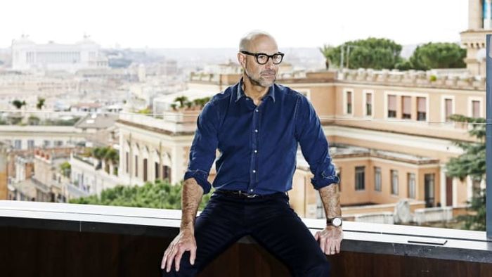 Stanley Tucci appears completely at ease while being photographed at Rome's luxurious Hotel Eden.
