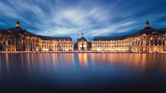 The Miroir d'Eau bathed in the glow of sunset