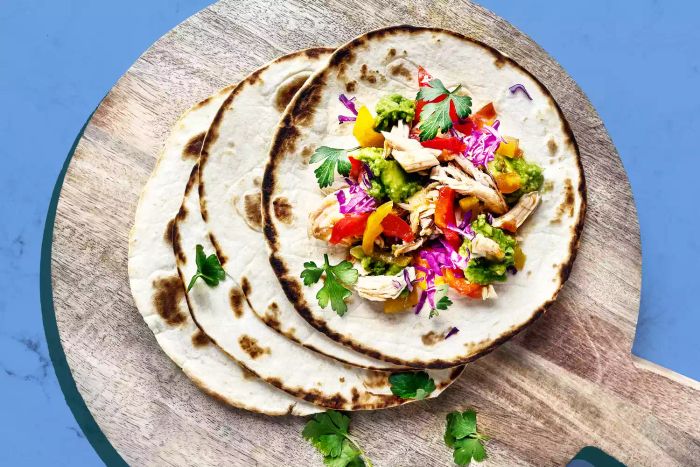 Tortillas laid out on a cutting board