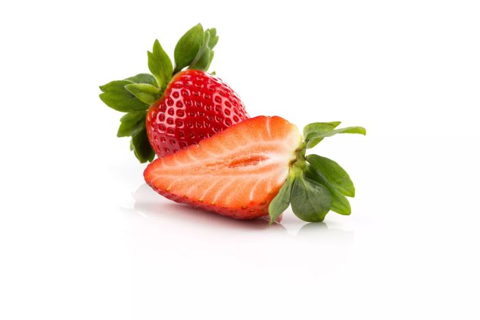 Red ripe strawberry fruits on a dark background