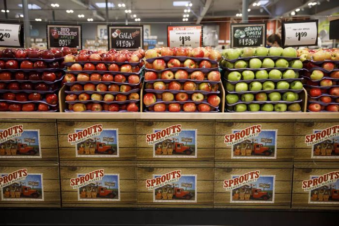Sprouts Market’s apple section, a testament to its fresh and diverse offerings, draws shoppers looking for quality and variety.