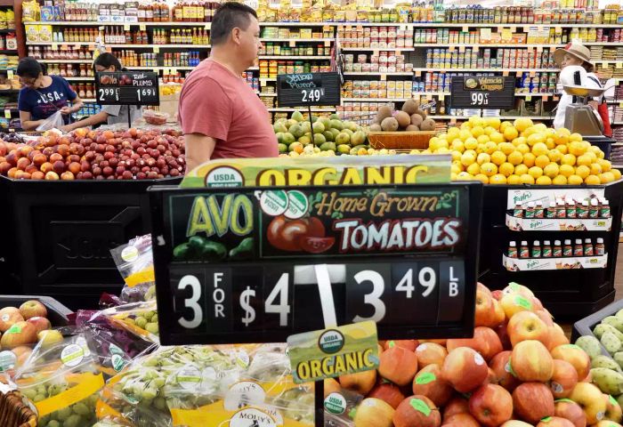 Shoppers browsing the aisles of a supermarket, searching for fresh groceries and essentials, is a common sight in any neighborhood store.