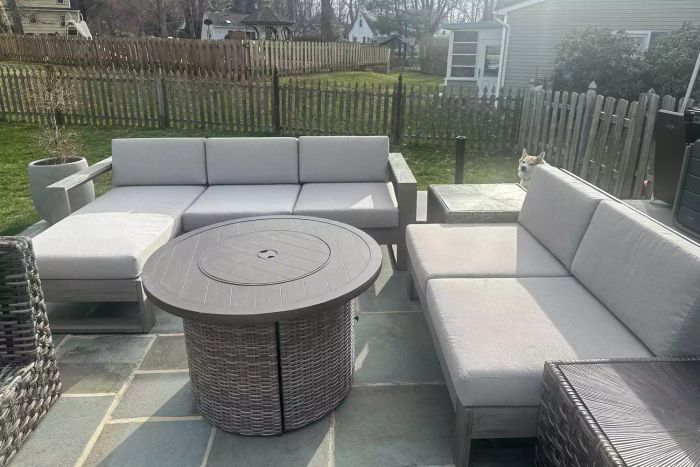 The West Elm Portside Outdoor 3-Piece Chaise Sectional displayed on a patio
