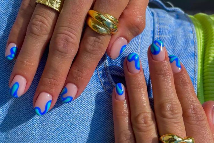 Manicure for short nails with a vibrant blue polish