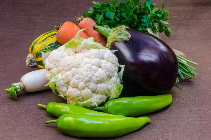 A still life arrangement featuring raw, fresh vegetables, symbolizing healthy eating.