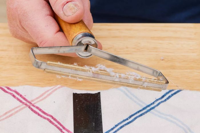 A detailed close-up of fabric shavings collected on Ruri's Portable Lint Remover