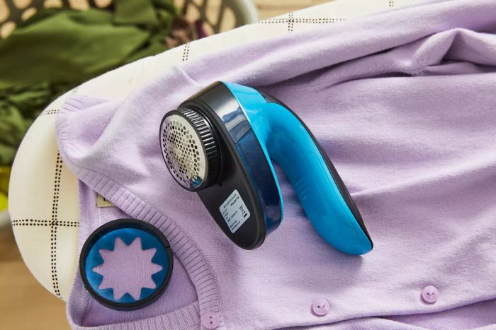 The Rowenta Portable Lint Remover Shaver, designed with an adjustable shave height for versatile fabric care.