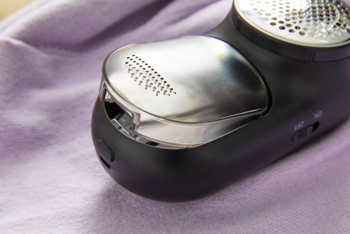 A detailed close-up of the Magictec Rechargeable Fabric Shaver