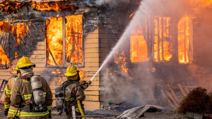 On December 8, 2020, in Klamath Falls, Oregon, firefighters engage in a controlled burn exercise to practice structural fire scenarios.