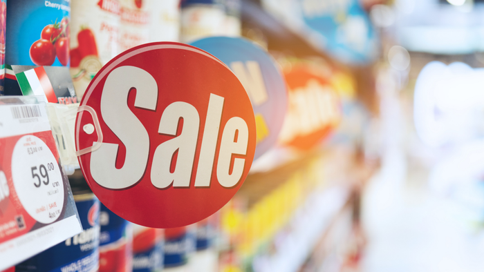 A sign advertising a sale in a supermarket