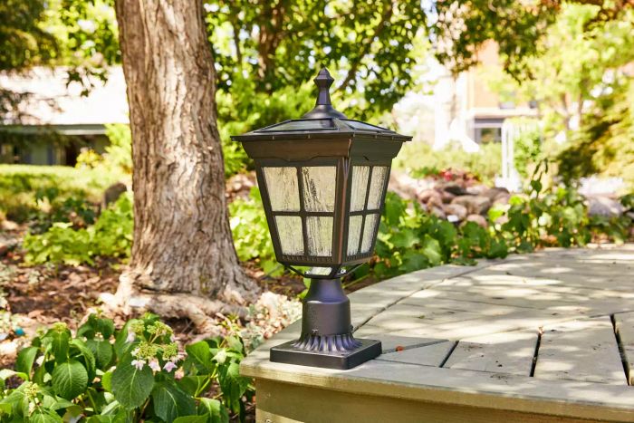 Kemeco Solar Post Light placed on the edge of an outdoor patio