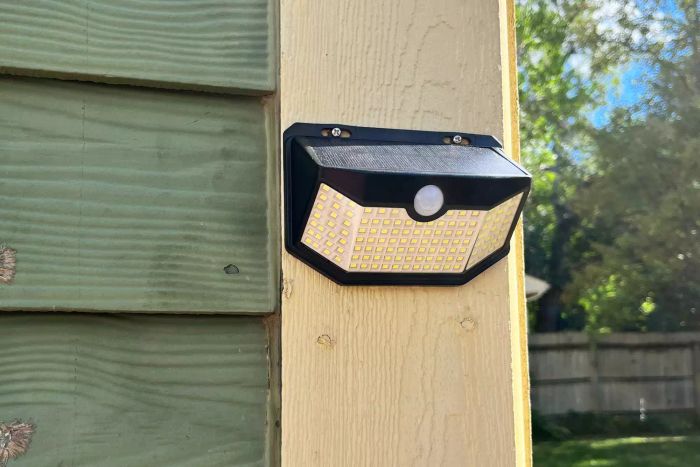 HMCITY Outdoor 120 LED Solar Light mounted on the corner of a house