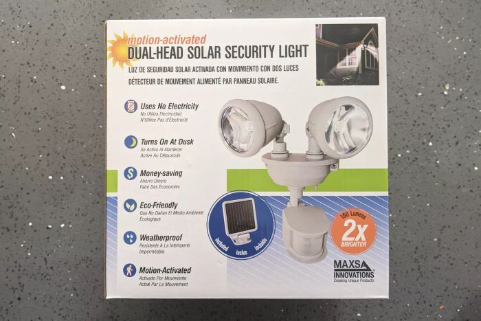 Maxsa Motion-Activated Dual Head Solar Security Light packaging displayed on a grey surface