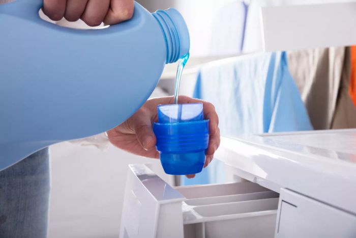 Liquid detergent being dispensed into a cup