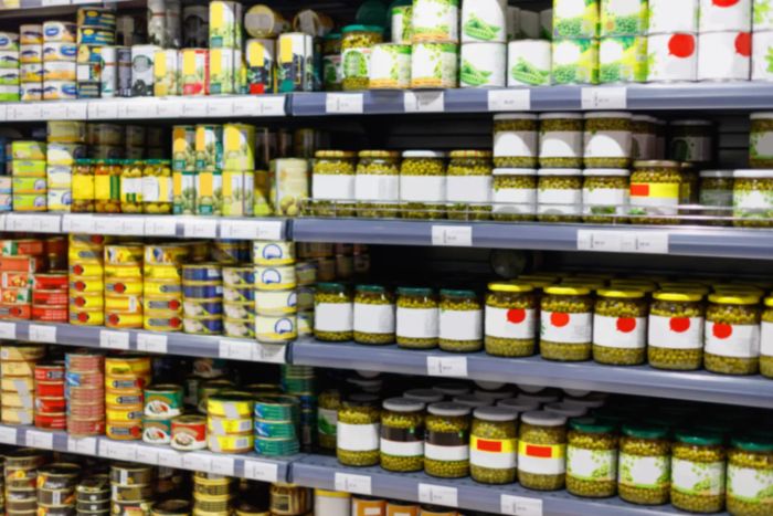 Cans of food on the shelves in a store