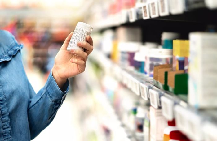 Customer holding a bottle of medication