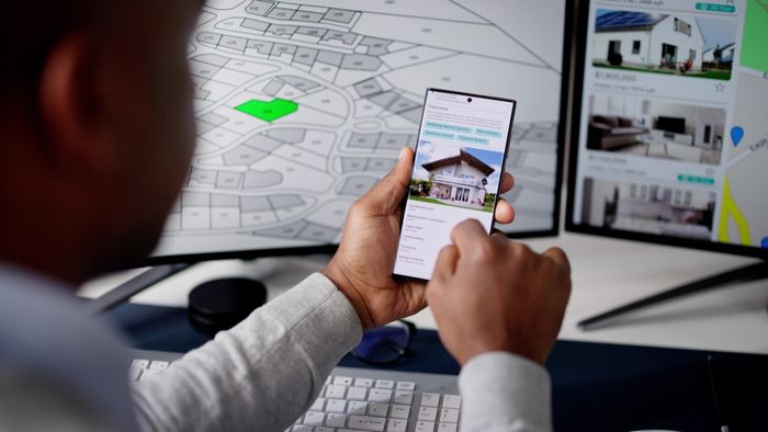 Person browsing real estate listings on a smartphone