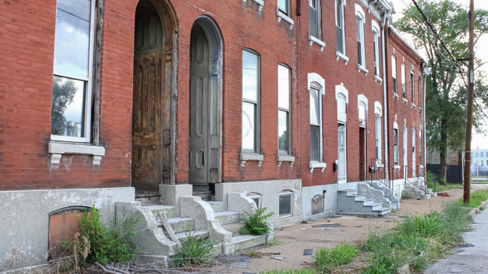 dilapidated brick apartment building