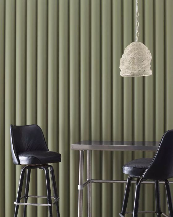Tate olive paint color applied to a wall