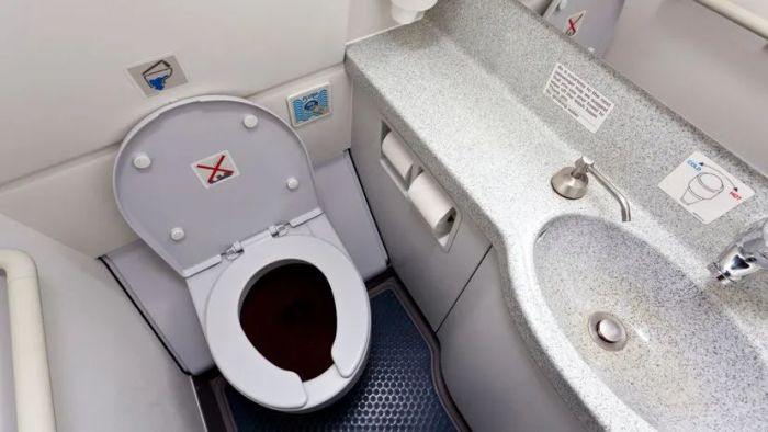 The restroom facilities in contemporary airplanes.