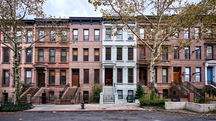 Historic brownstone buildings lined up in New York City