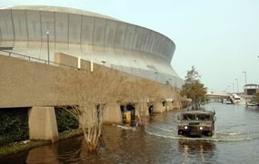 A National Guard Humvee leaves the New Orleans Superdome in Louisiana following Hurricane Katrina