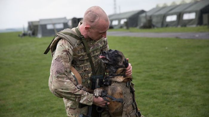 Private Terry Gizinski and his military working dog Cheyenne