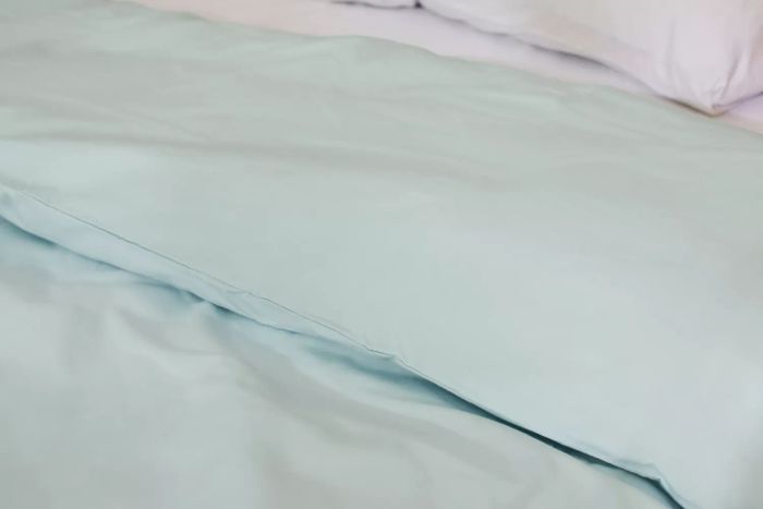 A close-up view of the Riley Percale Duvet Cover's fabric.