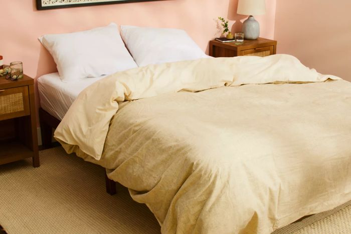 The Southern Living Simplicity Collection Tanner Duvet Cover displayed on a bed in a bedroom setting.