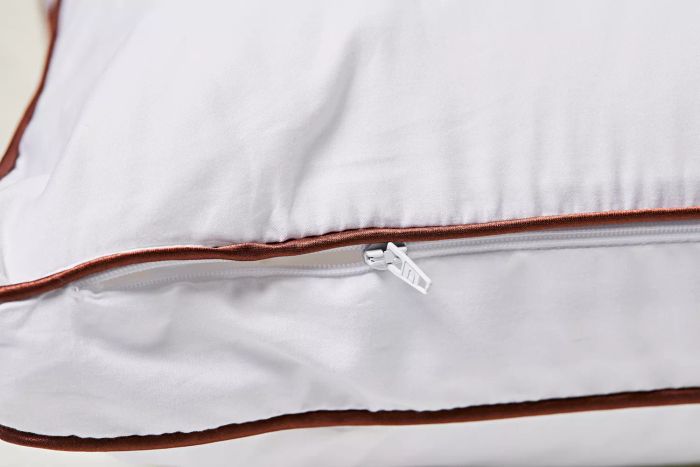 A detailed view of the zipper on the Saatva Latex Pillow