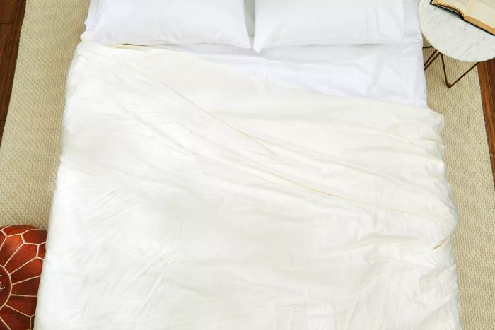 A bed showcasing The Company Store's Cotton Rayon Bamboo Sateen Duvet Cover