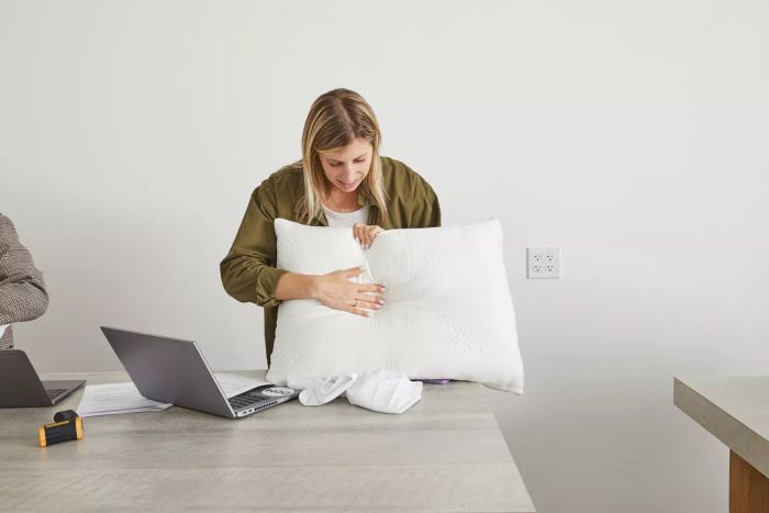 Person pressing hand into a Zen Bamboo Pillow