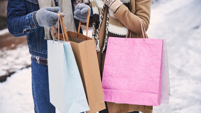 Couple holding shopping bags