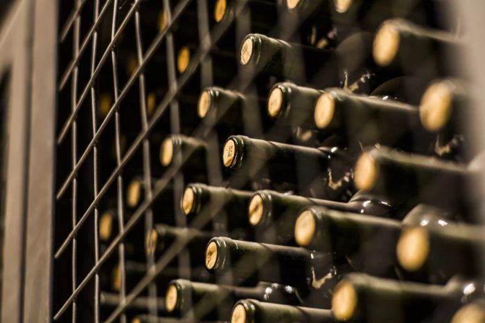 Bottles of wine neatly arranged on a shelf