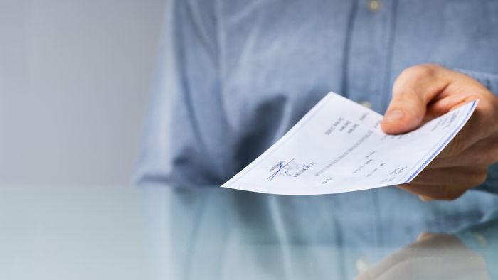 Person presenting a check
