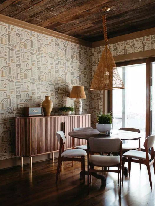 Rustic room with wood tones and patterned wallpaper