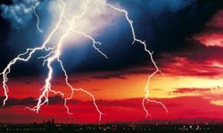 Lightning beneath an orange sky