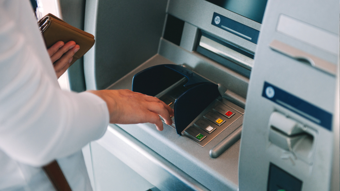Woman withdrawing cash from an ATM