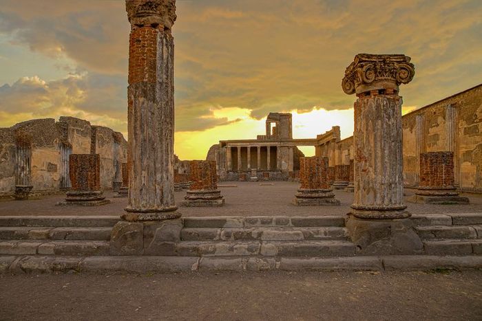 A photograph of the Basilica in Pompeii at sunset.
