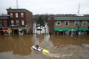 police, floodwaters, boats, citywide rescue operations