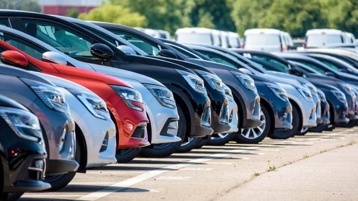 A lineup of brand-new vehicles at a dealership