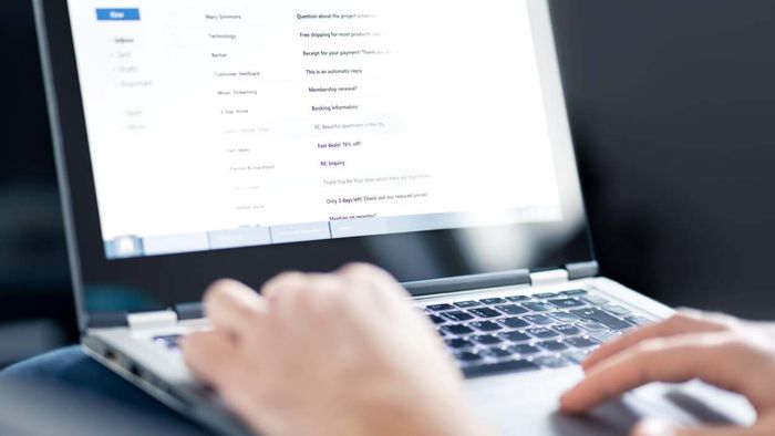 individual reviewing their email inbox