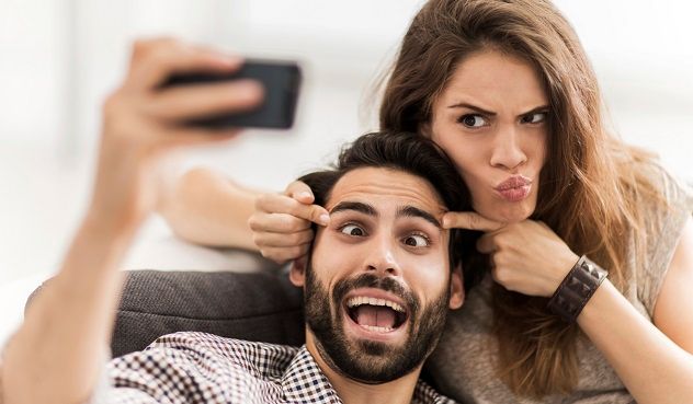 A couple taking a selfie.