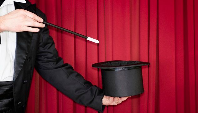 A magic trick being performed on stage