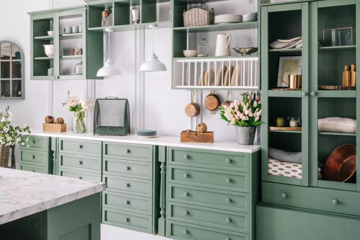 kitchen featuring cabinets painted in green